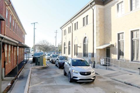 A line of vehicles sit in the drive-through lane at the Columbia County Tax Collector’s Office Monday. More than 300 people were served by the office Monday on one of the busiest days of the year. (TONY BRITT/Lake City Reporter)