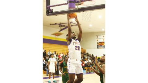 Columbia center Terrance Tolbert rises for a layup against Suwannee on Dec. 12. (PAUL BUCHANAN/Lake City Reporter)