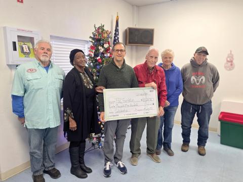 The Wellborn Community Association donated earlier this month toward a scholarship fund with the Foundation at Florida Gateway College to help students pursue Career and Technical Education degrees and certificates. Presenting the check to FGC Foundation Executive Director Lee Pinchouck were Sherm Stanley (from left), Fran Martin, Pinchouck, Bob Huffman, Pam Mikitta and Pedro Faria. (MONJA SLATER/Lake City Reporter)