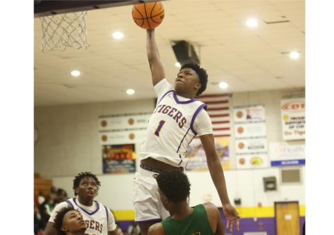 Columbia guard Shaheed White, soaring in for a bucket against Suwannee on Dec. 12, leads the Tigers offensively heading into this weekend’s Holiday Hoopfest in Fort Myers. (PAUL BUCHANAN/Lake City Reporter)