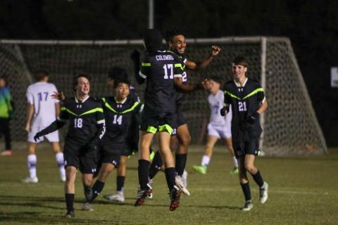 Columbia's Josiah Hopkins (12) celebrates with teammates after scoring a goal against Keystone Heights on Nov. 10. 2025. (BRENT KUYKENDALL/Lake City Reporter)