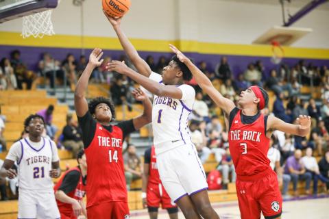 Columbia guard Shaheed White drives between The Rock defense for a layup on Tuesday. (BRENT KUYKENDALL/Lake City Reporter)