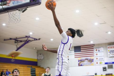 Columbia guard Shaheed White makes a layup against Buchholz on Tuesday. (BRENT KUYKENDALL/Lake City Reporter)