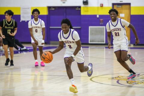 Columbia guard Kadrian Willson dribbles on a fast break for a game-sealing dunk against Buchholz on Tuesday. (BRENT KUYKENDALL/Lake City Reporter)