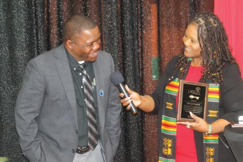 Assistant City Manager Dee Johnson (left) accepts a plaque from Councilwoman Chevella Young during the inaugural MLK Celebration Brunch on Sunday at the Richardson Community Center. (TONY BRITT/Lake City Reporter)