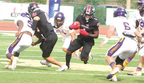 Fort White running back John’l Lawson hits the hole against Port St. Joe during the FIT Championship on Dec. 5, 2025. (FILE)