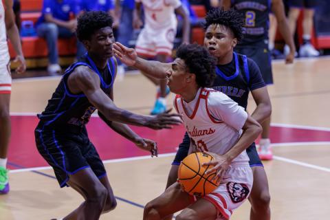 Fort White guard Tylan James drives to the basket against Newberry on Dec. 19. (JACK HOWDESHELL/Lake City Reporter)