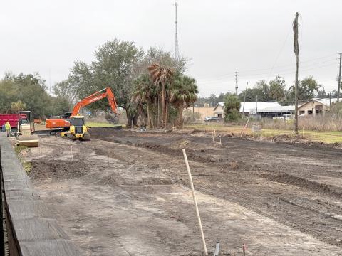 Curt’s Construction crews have begun work on parking improvements at the Heritage Square redevelopment area next to the Suwannee County Historical Museum. (JAMIE WACHTER/Lake City Reporter)