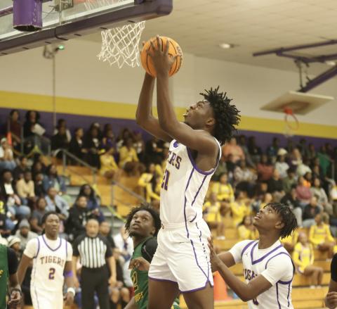 Columbia center Terrance Tolbert goes up for a layup against Suwannee on Dec. 12. (PAUL BUCHANAN/Lake City Reporter)