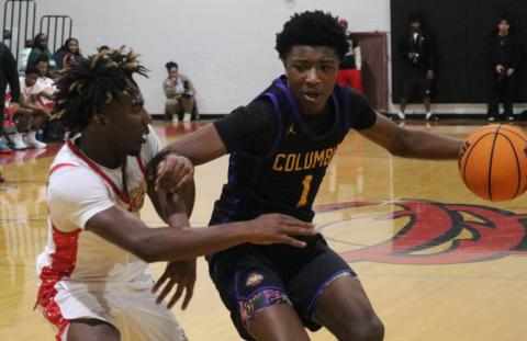Columbia guard Shaheed White drives to the basket while defended by Bradford guard Jordan Cason on Thursday. (JORDAN KROEGER/Lake City Reporter)