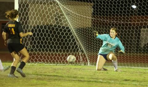 Suwannee goalkeeper Felicity May stops a shot from Columbia's Leah Shields on Friday. (PAUL BUCHANAN/Lake City Reporter)