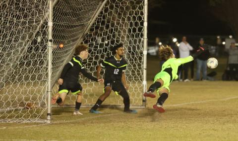 Columbia goalkeeper Logan Wheeldon makes a diving save against Suwannee on Dec. 1. (PAUL BUCHANAN/Lake City Reporter)