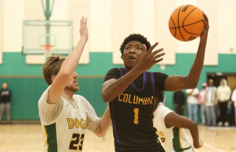 Columbia guard Shaheed White drives to the basket against Suwannee on Friday. (PAUL BUCHANAN/Lake City Reporter)