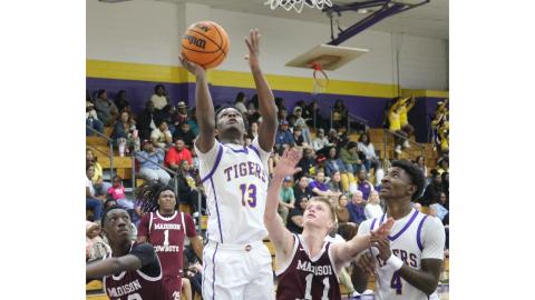 Columbia guard Jordaeton Youmans makes a layup against Madison County on Friday. (JORDAN KROEGER/Lake City Reporter)