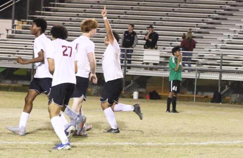 Suwannee striker Hector Velasquez (46) stands disappointed as Florida High’s Manuel Hernandez celebrates teammate Keenen Jeune’s game-winning goal in double overtime of Friday’s District 2-3A semifinal. (MORGAN MCMULLEN/Lake City Reporter)