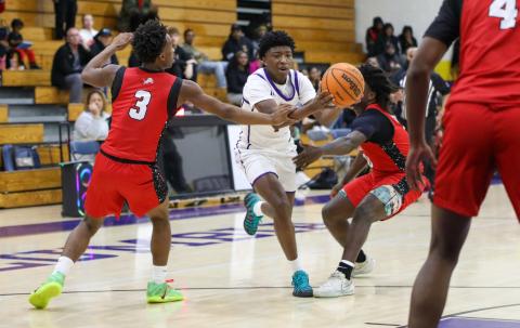 Columbia guard Shaheed White is fouled by Leon guard Elijah Knight while driving to the basket during Thursday's District 2-5A semifinal. (BRENT KUYKENDALL/Lake City Reporter)