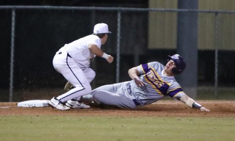Columbia right fielder Tison McCray is tagged out by Buchholz third baseman Roen Kresak while trying to steal on Thursday. (BRENT KUYKENDALL/Lake City Reporter)