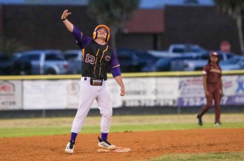 Columbia pitcher Kyler Keen celebrates at second base after hitting a two-RBI double against Episcopal on Thursday. (BRENT KUYKENDALL/Lake City Reporter)