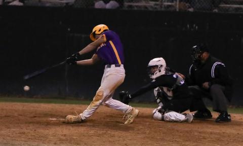 Columbia second baseman Goose Lord swings and misses at a pitch against Providence in the sixth inning Tuesday night. He struck out with the bases loaded. (BRENT KUYKENDALL/Lake City Reporter)