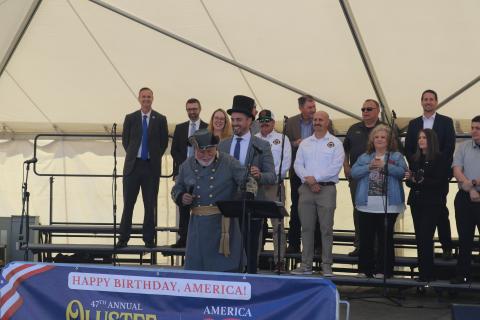 Lake City Mayor Noah Walker and Blue-Grey Army Commanding General Tony Buzzella (center) share a laugh during the opening ceremony of the 47th annual Olustee Festival on the banks of Lake DeSoto at Wilson Park. (TONY BRITT/Lake City Reporter)
