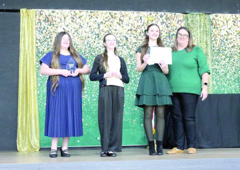 Sixth grade winners in the Suwannee County 4-H Public Speaking Contest were Kendell Wynn, third place (from left); Mikayla Richardson, second place; Kellyn Crocker, first place; and Katie Jones, 4-H Extension Agent. (COURTESY)