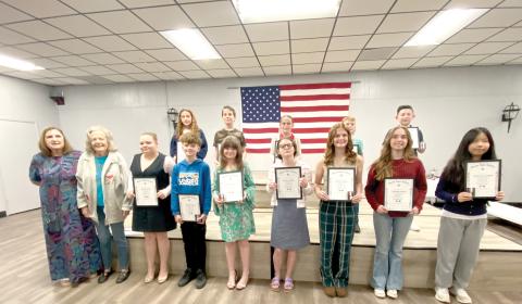 American Legion Auxiliary Unit 57 American Essay Contest winners included, in front, Irma Wehrli (from left), Judy Ripple, Kynlee Bogie, Timothy Steele, Kazzeley Vernon, Darien Cooper, Daelyn Cooper, Witness Hatch, Katheryn Coleman; back row, Olivia Medeiros, William Matheney, Madison Cruess, Kaiden Berg and Mason Garling. (COURTESY)