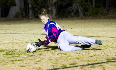 Branford goalkeeper Samantha Ray makes a save against Dixie County in the District 2-2A championship on Jan. 26. (JACK HOWDESHELL/Lake City Reporter)