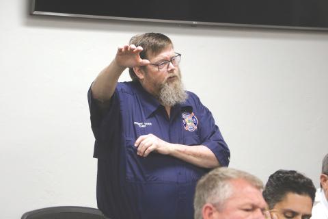 Robert Yates, shown speaking at a Branford Town Council workshop in January about consolidating its service into Suwannee County’s paid service, resigned as fire chief for the town last week. (FILE)
