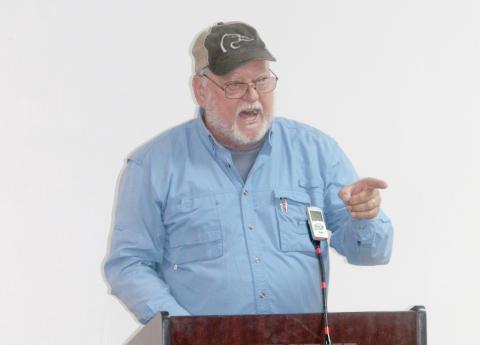 Fort White resident Carl King angrily responds to the Fort White Town Council during its special meeting Tuesday night about town dissolution. (TONY BRITT/Lake City Reporter)
