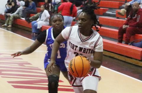 Fort White guard Zuri Hollie drives to the basket against Taylor County during the District 6-R championship on Feb. 6. (MORGAN MCMULLEN/Lake City Reporter)