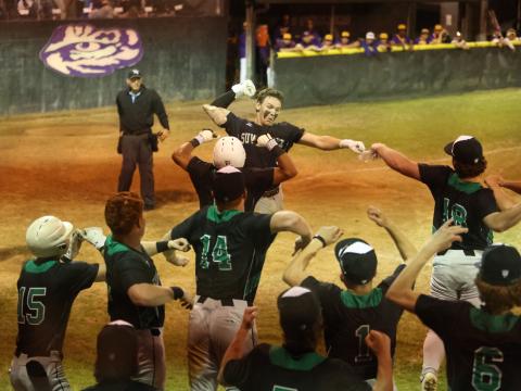 Suwannee catcher Jace Moran celebrates with teammates after hitting a two-run home run against Columbia on Wednesday. (PAUL BUCHANAN/Lake City Reporter)