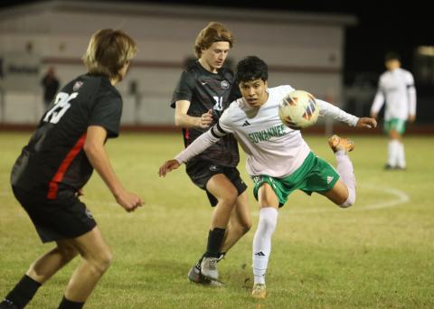 Suwannee midfielder Scott Uribe chases after possession against Santa Fe during Tuesday's Region 1-3A quarterfinal. (PAUL BUCHANAN/Lake City Reporter)