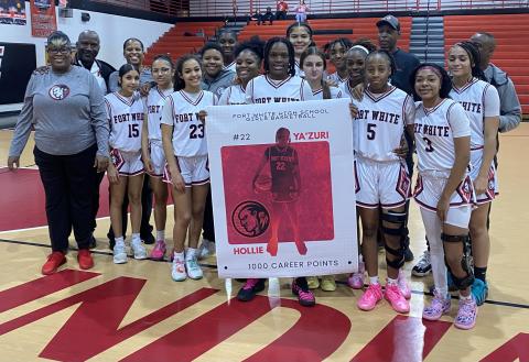 Fort White guard Zuri Hollie was honored for hitting the 1,000-point mark in her career during the Indians’ 69-38 win over Trenton in the District 6-R semifinals on Wednesday. (COURTESY)