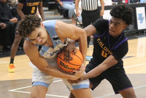 Columbia guard Murkail Cray fights for a loose ball with Ponte Vedra forward Maddox Palmer during Saturday's Region 1-5A semifinal. (JORDAN KROEGER/Lake City Reporter)