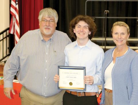 Fort White student Cody Maggard was recognized by the Columbia County School Board on Tuesday for being named the district’s Sunshine State Scholar. Maggard is pictured with Superintendent Keith Couey and School Board Chair Dana Brady-Giddens. (TONY BRITT/Lake City Reporter)