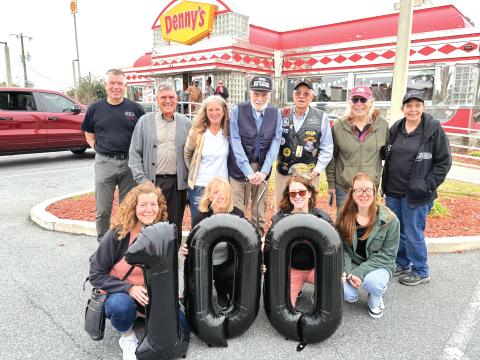 World War II veteran Edward McCarthy (back row, center) celebrated his 100th birthday with his family as well as other American Legion Post 57 vets and members of the Columbia County Sheriff’s Office. McCarthy is a retired corporal who served with the United States Marine Corps, earning both a Bronze Star and Purple Heart during his service. (COURTESY)