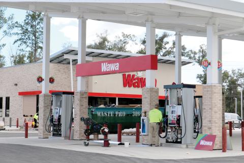 Signage was erected Tuesday on the Wawa convenience store at the U.S. Highway 90 and Ridgewood Avenue intersection. The store is expected to open in April. (TONY BRITT/Lake City Reporter)
