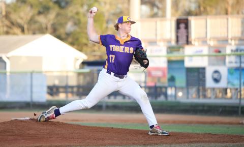 Columbia pitcher Nolan Slaymaker warms up to pitch against Providence on Feb. 24. (BRENT KUYKENDALL/Lake City Reporter)