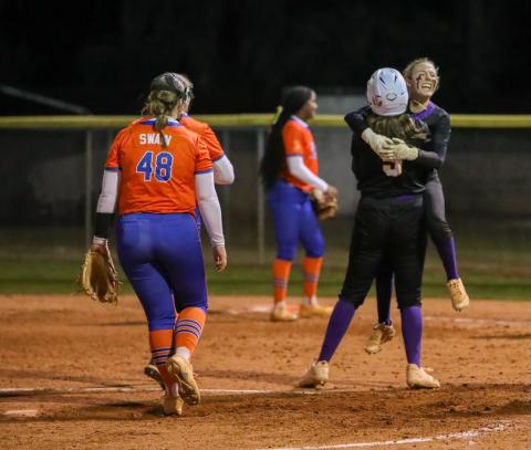 Columbia left fielder Addyson Sherman hugs first baseman Ava Christie (5) after hitting a walk-off single against Branford on Tuesday. (BRENT KUYKENDALL/Lake City Reporter)