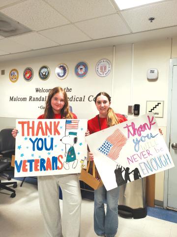 Youth volunteers show off thank-you signs supporting veterans. The Lake City VA Medical Center is currently looking for volunteers of all ages for various roles. (COURTESY)
