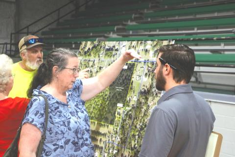 Maureen Bentley (left) speaks with Cory Chandler, an engineer with Landis Evans + Partners during last year’s presentation about the mixed-use development proposed for Live Oak across from the Suwannee County Coliseum. The property owners are now seeking to annex the parcels into the city. (FILE)