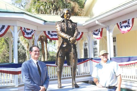 Florida Secretary of State Cord Byrd (left) stands with Bradley Cooley, the sculptor who created Alexander Hamilton statue unveiled on Wednesday at the Heritage Center in White Springs. (TONY BRITT/Lake City Reporter)