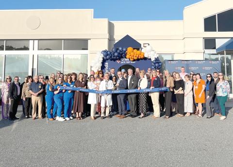 HCA Florida Lake City Surgical Specialists, alongside HCA Florida Lake City Hospital leaders and community members, gather in celebration before the ceremonial ribbon cutting marking the grand opening of the practice’s new location. (COURTESY HCA LAKE CITY HOSPITAL)