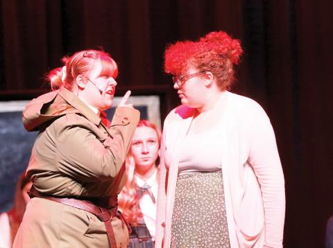 Miss Trunchbull, the headmistress at the school in ‘Matilda’ played by Lillian Sasser (left) scolds Matilda’s teacher Miss Honey, played by Jamylai Leon, during a scene from the Suwannee High theater troupe’s rehearsal for this weekend’s performances. (JAMIE WACHTER/Lake City Reporter)