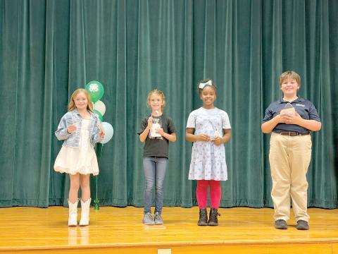 Fourth grade winners of the Columbia County 4-H Public Speaking County Contest pose with their awards. Winners were Charley Neeley of Westside Elementary, first place (from left); Teagyn Garcia of Fort White Elementary, second place; Ariella Mason of Columbia City Elementary, third place; and Eli McCray of Epiphany Catholic School, honorable mention. (COURTESY UF/IFAS EXTENSION COLUMBIA COUNTY)