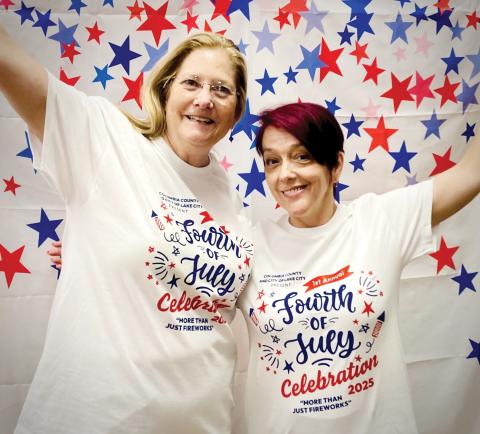 Art League President Laura Hunter-Null (left) and Gateway Art Gallery Curator Sheila Carr model last year’s winning T-shirt, designed by Erin Weiffenbach. (COURTESY)