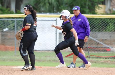 Columbia pitcher Ryleigh Stone rounds first base after hitting a single against West Nassau on Thursday. (BRENT KUYKENDALL/Lake City Reporter)