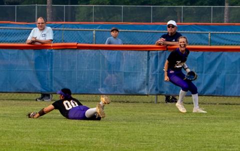 Columbia left fielder Addyson Sherman (right) celebrates after center fielder Luisa Taylor (00) makes a diving catch for an out against Branford on Tuesday. (JACK HOWDESHELL/Lake City Reporter)