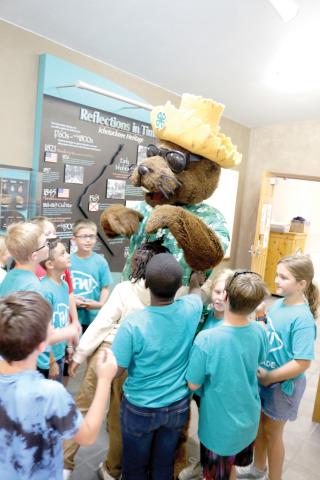 Local elementary school students meet Bellamy Beaver during a water conservation and quality event at Ichetucknee Springs State Park on Thursday morning. (TONY BRITT/Lake City Reporter)