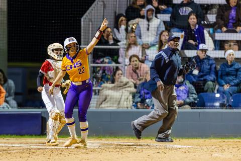Columbia catcher Emily Delgado points to her home run as it flies over the fence during Tuesday's 13-2 win over Lafayette. (JACK HOWDESHELL/Lake City Reporter)